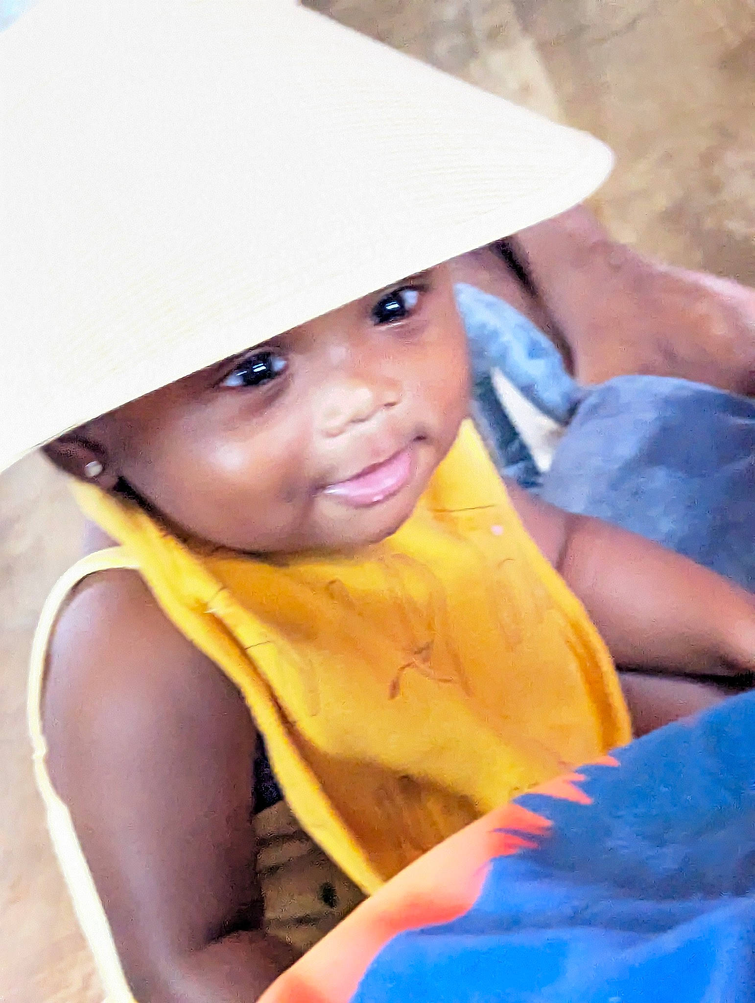 Campbell joined the competition — help win amazing prizes! azure, baby, baby_products, blue, cap, child, costume, costume_hat, electric_blue, facial_expression, fashion_accessory, fun, happy, headwear, leisure, person, sitting, smile, sun_hat, toddler