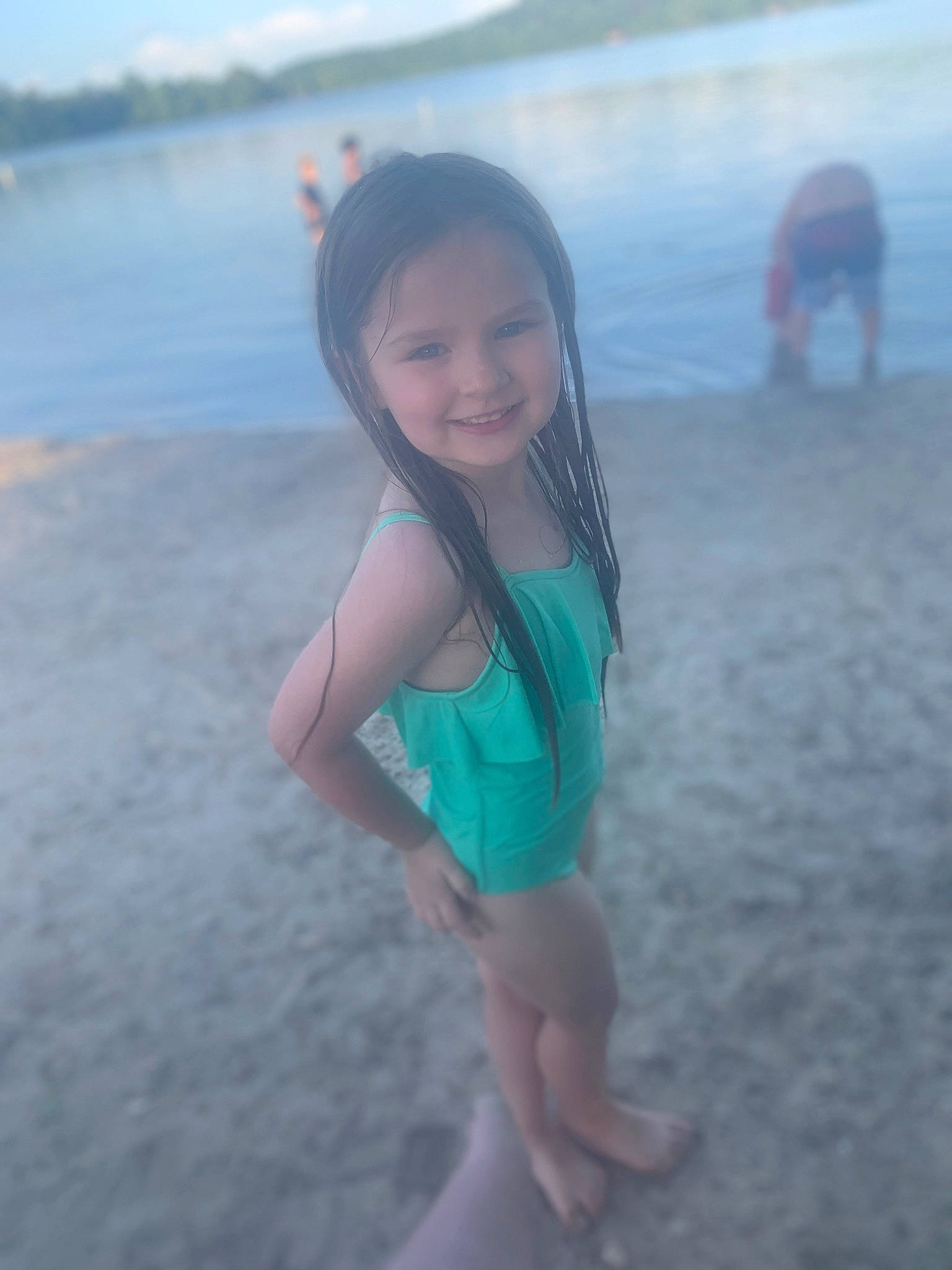 Hadleigh is registered to the contest to win money with this photo: azure, beach, coastal_and_oceanic_landforms, eye, hair, happy, horizon, joy, landscape, leg, leisure, long_hair, natural_environment, person, sand, sky, smile, summer, sunlight, thigh