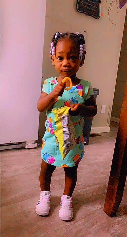 India is registered to the contest to win money with this photo: art, baby_toddler_clothing, child, costume, entertainment, event, face, fashion_design, flooring, fun, hair, happy, leg, leisure, person, room, sunglasses, t_shirt, toddler, trunk