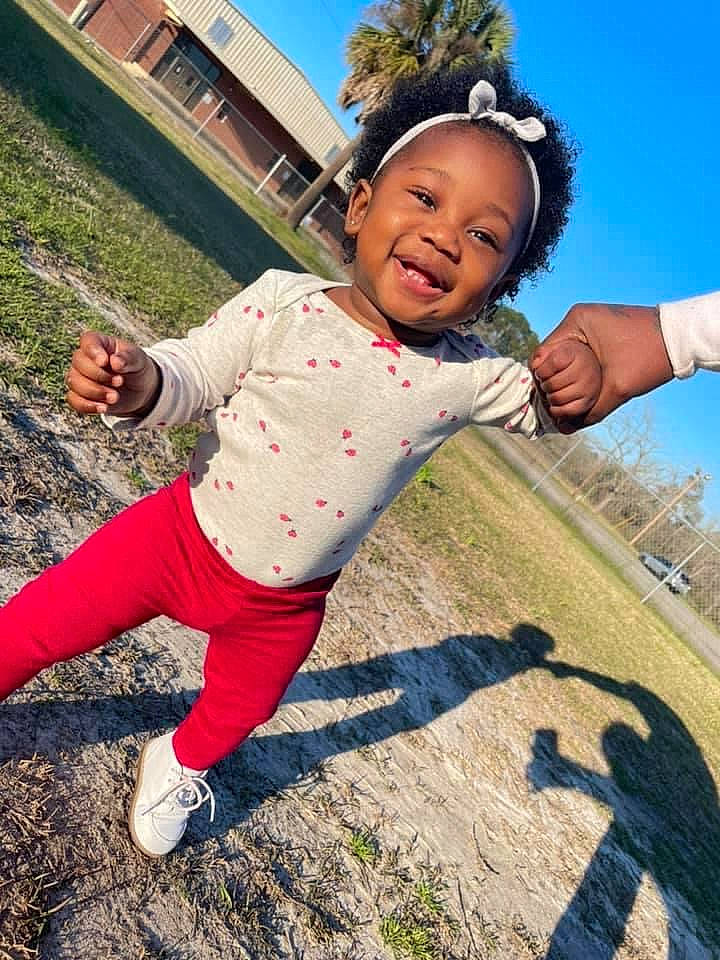 India joined the competition — help win amazing prizes! baby_toddler_clothing, finger, fun, gesture, grass, grassland, hand, happy, joy, leisure, outdoor_play_equipment, people_in_nature, person, playground, recreation, shoe, sky, sleeve, sneakers, swing