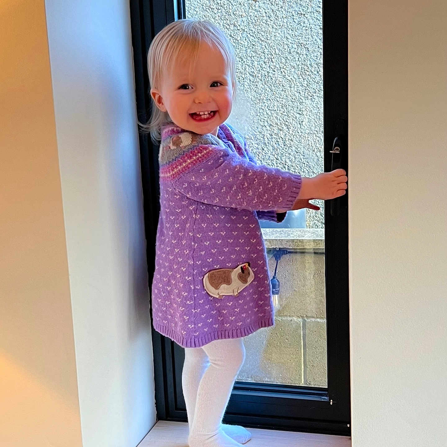 Astrid joined the competition — help win amazing prizes! blonde, child, clothing, coat, door, dress, face, female, footwear, girl, hair, happy, hardwood, head, hosiery, indoors, interiordesign, jeans, longsleeve, pants