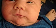 Lucas joined the competition — help win amazing prizes! baby, infant, face, blue_clothing, chubby_cheeks, closeup, indoor, person, newborn, skin, head, eyes, mouth, nose, arm, foot, blanket, soft_light, casual, portrait