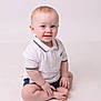 baby, child, infant, smiling, sitting, white_polo, shorts, blue_eyes, cute, portrait, studio, light_background, hands, feet, happy, toddler, skin, face, young, indoors