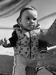 Ilyas participe au concours pour gagner de l'argent avec cette photo : baby, beauty, black_and_white, cheek, child, comfort, eye, flash_photography, fun, gesture, hand, happy, head, monochrome, monochrome_photography, person, sitting, sleeve, standing, style