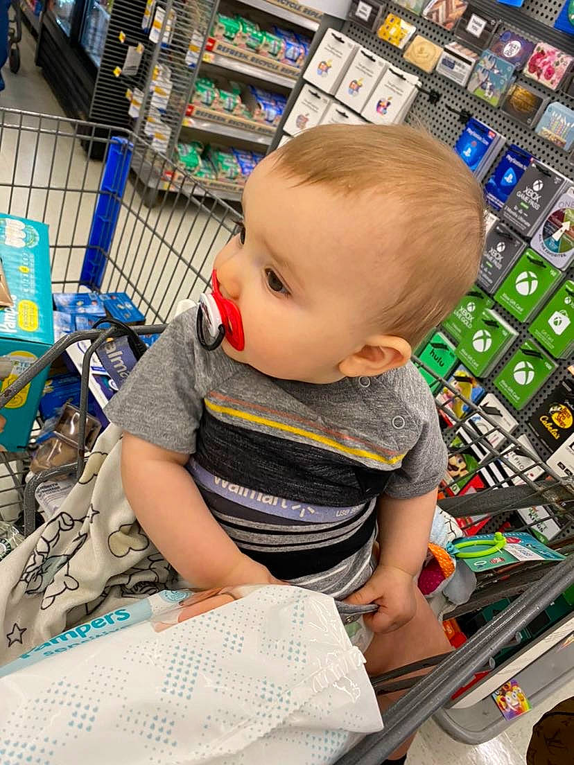 Layken joined the competition — help win amazing prizes! baby, baby_toddler_clothing, blue, cheek, child, convenience_store, customer, fun, hairstyle, human, iris, person, photograph, product, retail, service, shelf, shopping_cart, snapshot, t_shirt