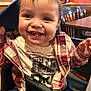 Jeremiah joined the competition — help win amazing prizes! toddler, smiling, child, happy, face, clothing, red_plaid_jacket, high_chair, restaurant, wooden_chair, table, indoors, person, cute, baby, cheerful, sitting, hood, expression, casual_wear