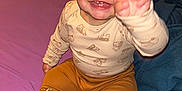 Jeremiah joined the competition — help win amazing prizes! baby, child, smiling, pajamas, socks, bed, blanket, indoor, furniture, happy, cute, person, face, hand, clothing, toddler, purple_bedspread, toy, room, air_conditioner