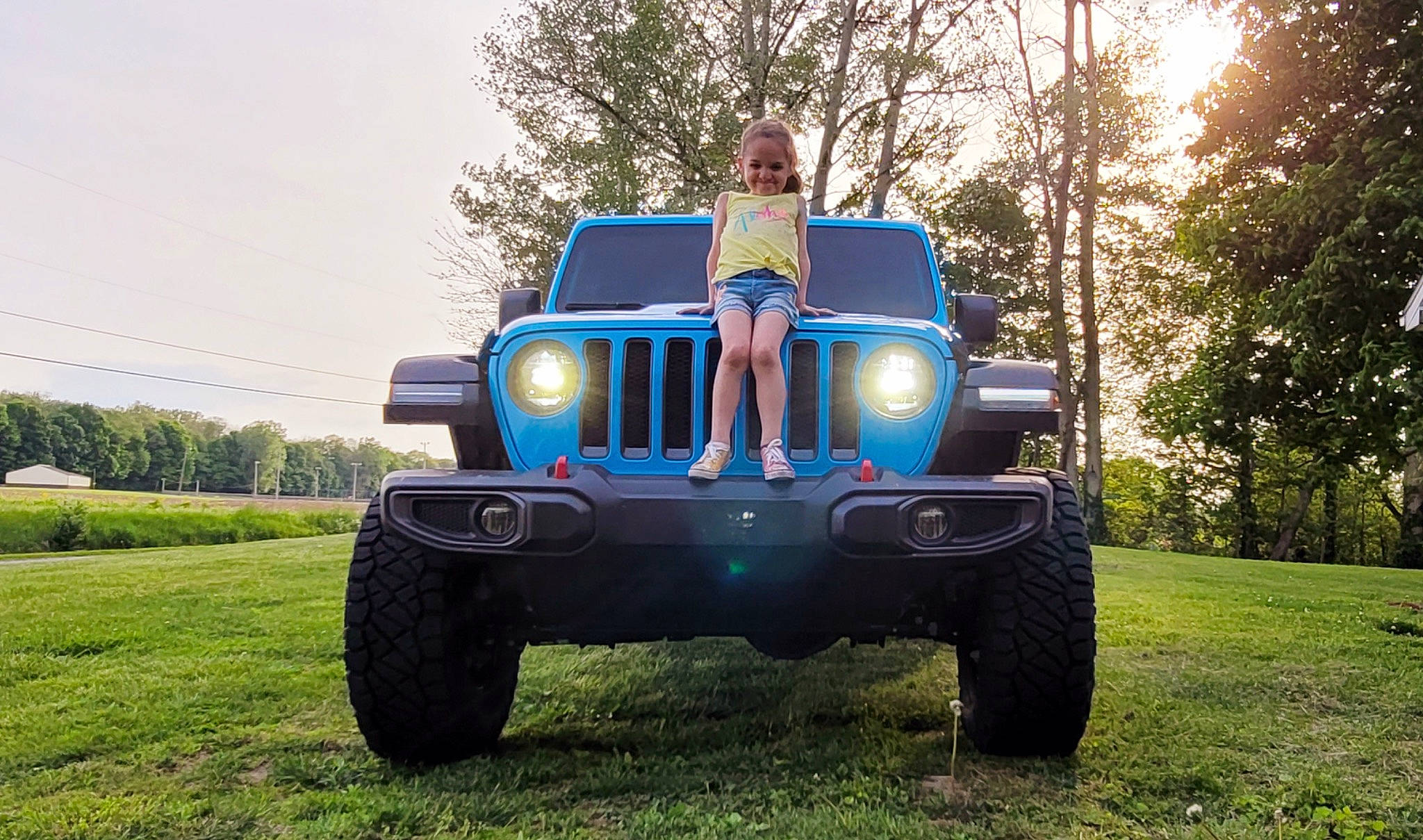 Allena joined the competition — help win amazing prizes! automotive_design, automotive_exterior, automotive_lighting, automotive_tire, bumper, car, dress, fender, hood, jeans, joy, land_vehicle, motor_vehicle, person, plant, sky, tire, tread, tree, truck