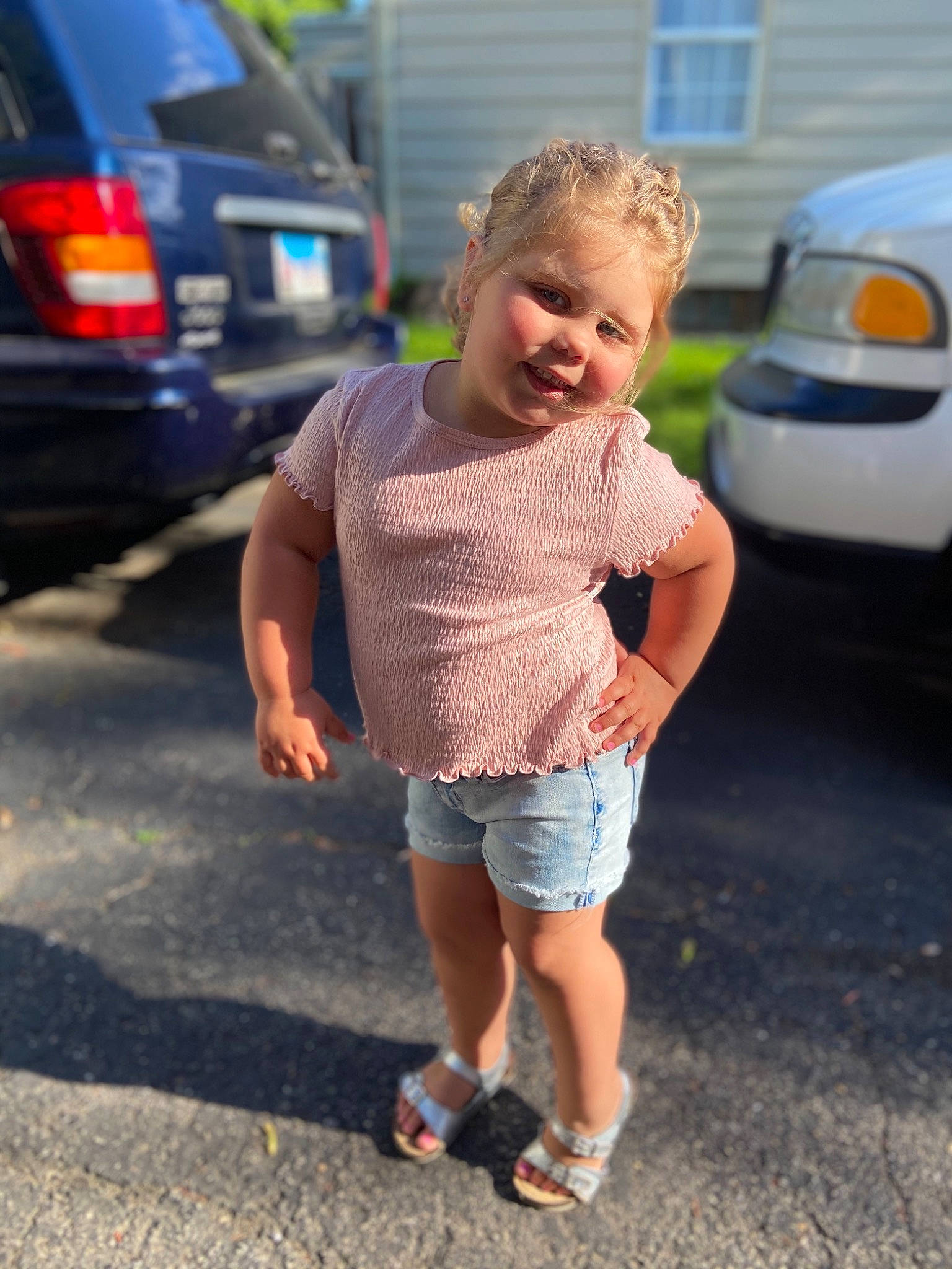 Camryn is registered to the contest to win money with this photo: car, child, family_car, footwear, leg, luxury_vehicle, person, photography, shoe, shorts, smile, subcompact_car, summer, toddler, vacation, vehicle, vehicle_door, walking