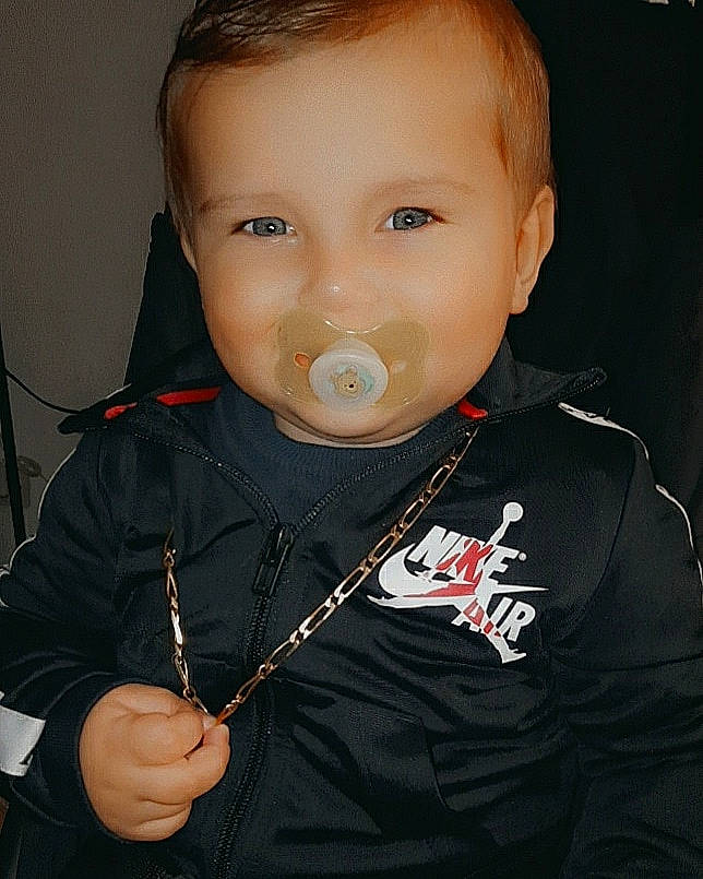 Louis participe au concours pour gagner de l'argent avec cette photo : audio_equipment, baby, baby_toddler_clothing, cheek, collar, cool, drinkware, ear, eyelash, fashion_accessory, flash_photography, fun, gesture, happy, hearing, jewellery, joy, neck, person, sleeve