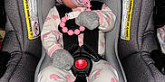 Brielle joined the competition — help win amazing prizes! baby, car_seat, child, cute, elephant_pattern, gray, headband, indoors, infant, mittens, newborn, pacifier, pajamas, pink, pink_bow, portrait, resting, safety_harness, seat_belt, wearing_clothes