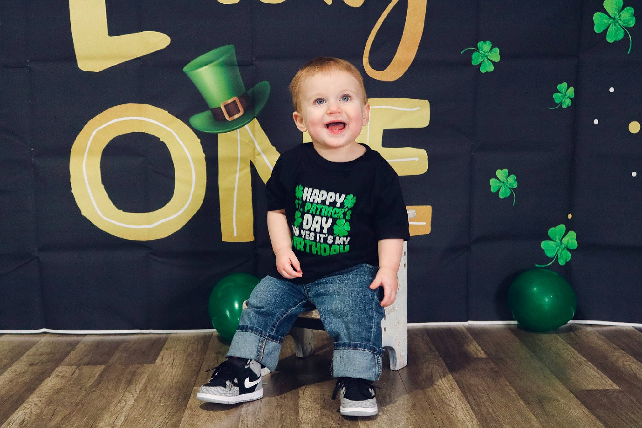 Aiden is registered to the contest to win money with this photo: baby_toddler_clothing, child, event, floor, flooring, fun, green, happy, hardwood, jeans, joy, laminate_flooring, logo, person, play, product, smile, standing, t_shirt, toddler