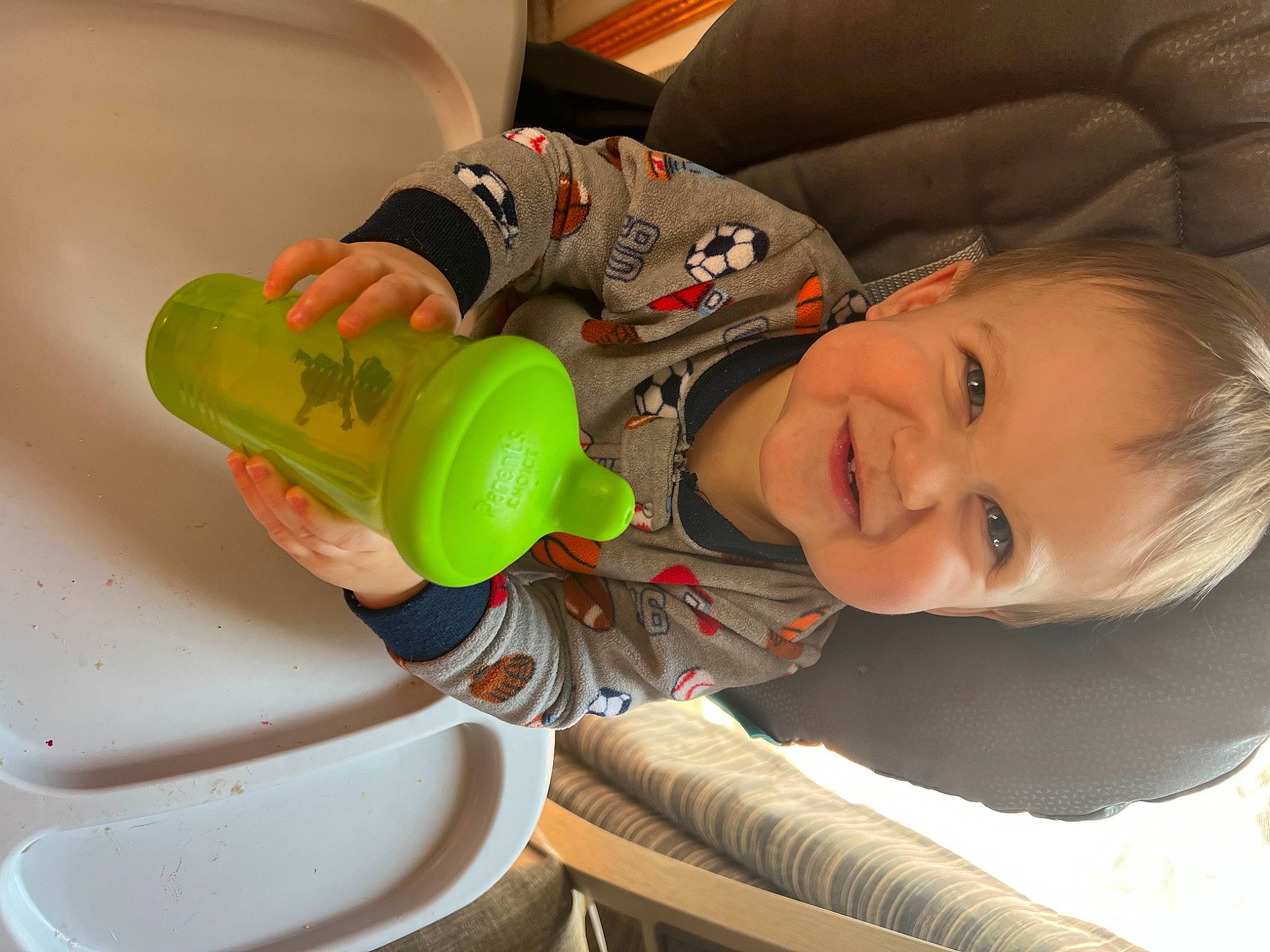 Aiden joined the competition — help win amazing prizes! automotive_wheel_system, baby, baby_products, baby_toddler_clothing, bottle, child, comfort, drink, drinking, drinkware, fun, happy, joy, person, plastic, plastic_bottle, play, sitting, smile, tableware