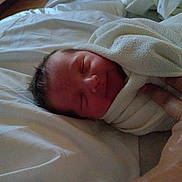 Matthias is registered to the contest to win money with this photo: newborn, baby, wrapped, towel, bed, sleeping, smiling, hand, soft, blanket, rest, cute, infant, face, skin, peaceful, indoor, person, cozy, comfort