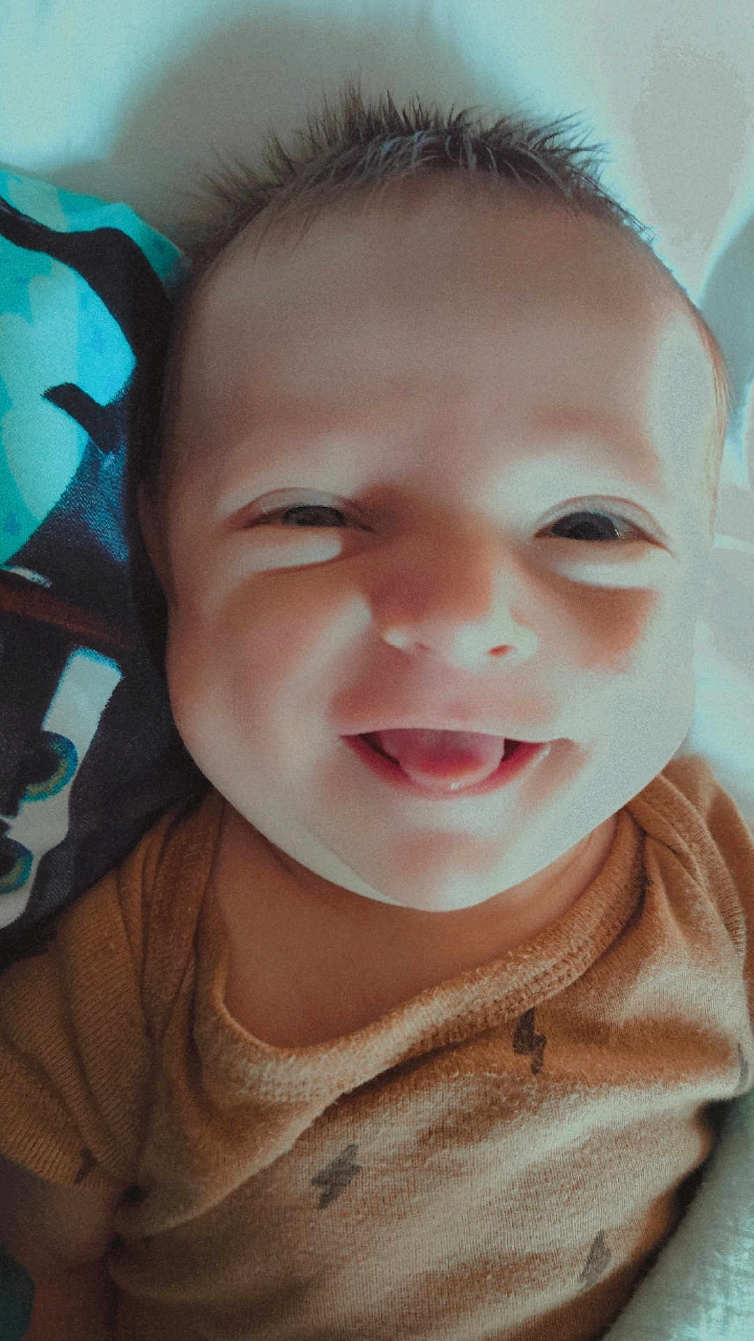Matthias joined the competition — help win amazing prizes! baby, smiling, face, tongue, hair, blanket, clothing, infant, cute, happy, portrait, closeup, child, person, skin, young, expression, indoors, cozy, toddler
