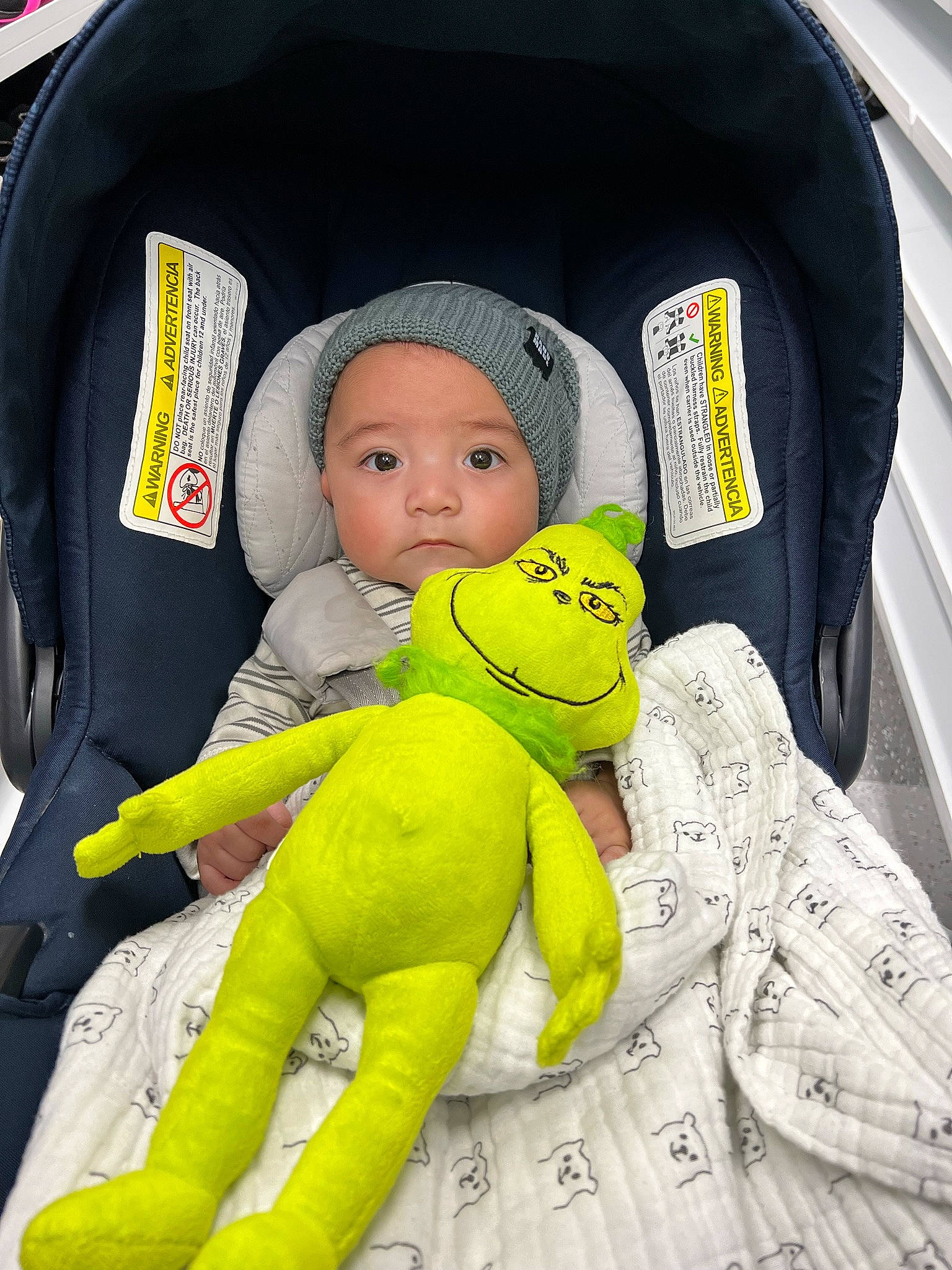 David is registered to the contest to win money with this photo: baby, baby_carriage, baby_in_car_seat, baby_products, baby_safety, baby_sleeping, baby_toddler_clothing, cap, car_seat, cheek, child, comfort, fun, headwear, linens, person, personal_protective_equipment, photograph, product, sitting