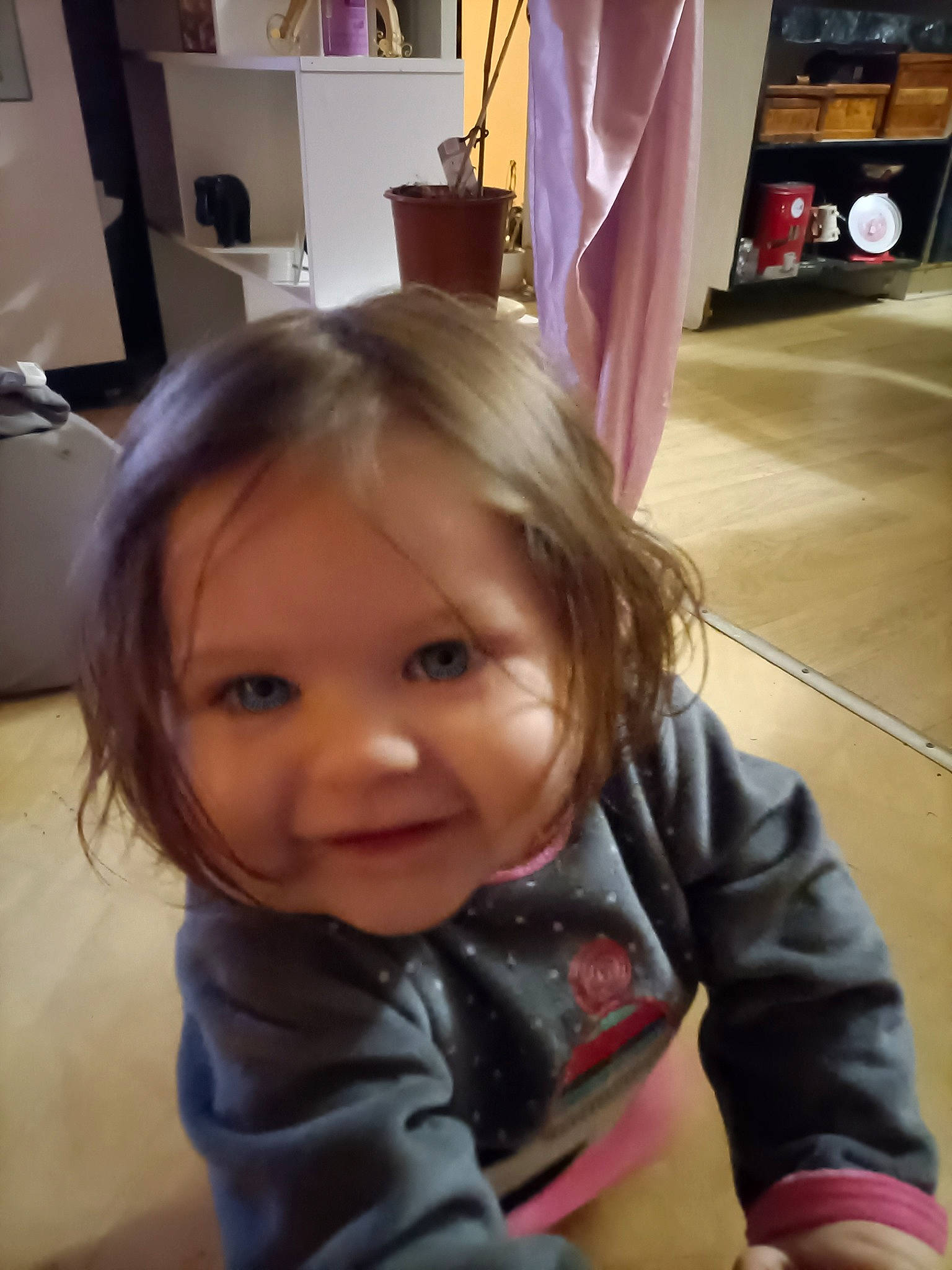 Kelly participe au concours pour gagner de l'argent avec cette photo : baby, baby_toddler_clothing, blond, cheek, child, eyelash, floor, flooring, fun, happy, head, iris, joy, long_hair, nose, person, skin, sleeve, smile, standing