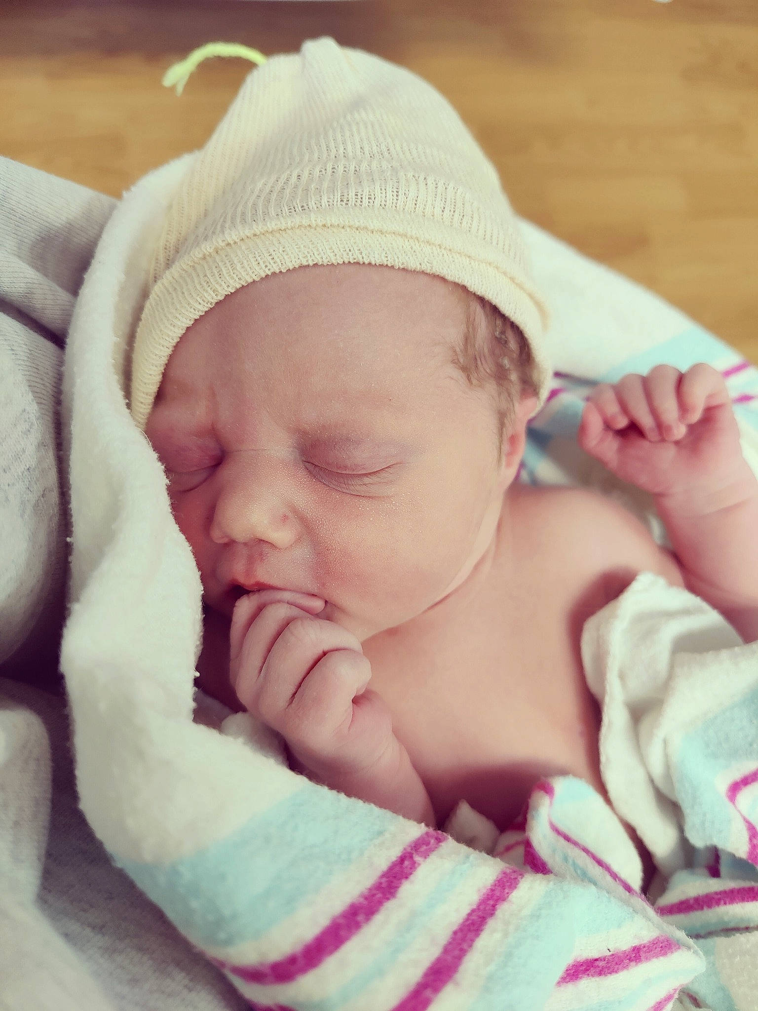 Saylor is registered to the contest to win money with this photo: baby, baby_sleeping, baby_toddler_clothing, bedtime, cheek, close_up, comfort, eye, face, finger, grass, happy, head, headgear, linens, lip, person, pink, skin, thumb