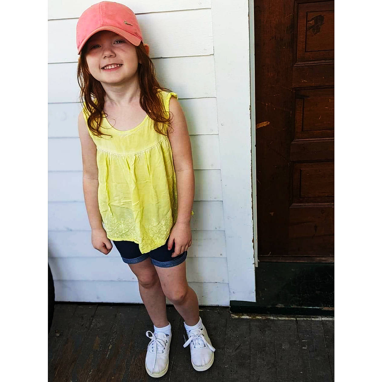 Juniper joined the competition — help win amazing prizes! baby_toddler_clothing, baseball_cap, cap, clothing, door, face, happy, head, headwear, joy, magenta, neck, pattern, person, pink, sleeve, sleeveless_shirt, smile, standing, street_fashion