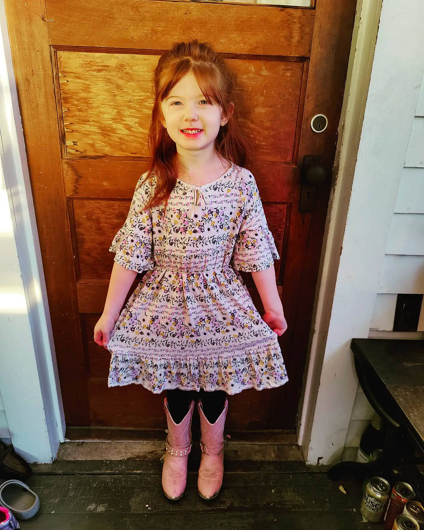 Juniper is registered to the contest to win money with this photo: dress, embellishment, facial_expression, fashion_design, fawn, floor, hair, joy, leg, neck, one_piece_garment, outerwear, person, pink, shoulder, skin, sleeve, smile, standing, thigh