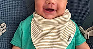 Armaan joined the competition — help win amazing prizes! baby, infant, child, smiling, happy, portrait, face, eyes, outdoor, car_seat, safety_seat, bib, striped_bib, turquoise_clothing, green_shirt, sitting, close_up, head, person, photography