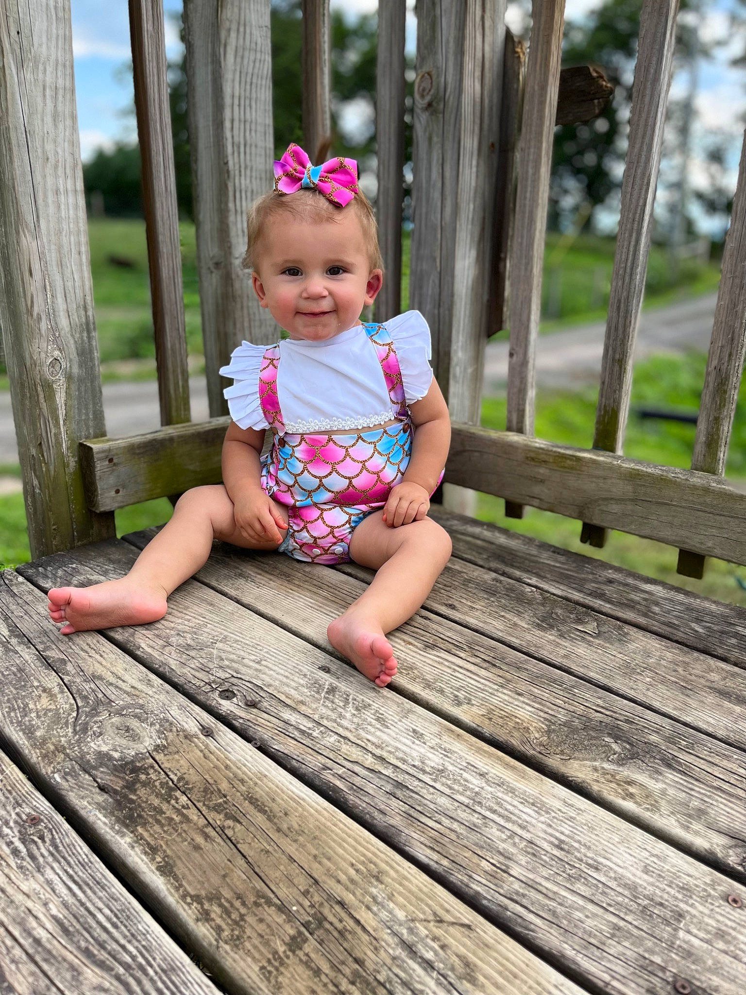 Emerleigh joined the competition — help win amazing prizes! baby, baby_toddler_clothing, child, deck, fun, grass, happy, hardwood, joy, leg, leisure, magenta, person, plant, recreation, skin, sky, smile, toddler, tree