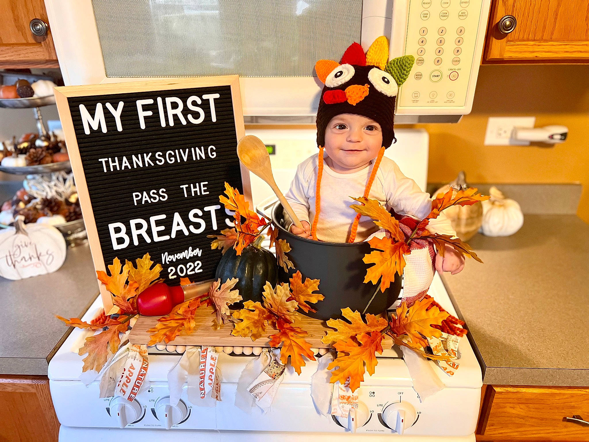 Lincoln is registered to the contest to win money with this photo: advertising, chef, comfort_food, cook, cooking, culinary_art, event, font, hat, headwear, joy, orange, person, plant, room, toddler