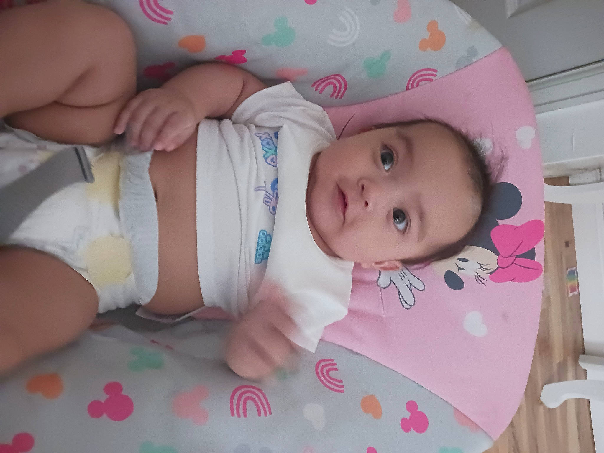 Ariah is registered to the contest to win money with this photo: abdomen, baby, baby_products, baby_safety, baby_toddler_clothing, cheek, child, comfort, eye, facial_expression, hand, headgear, nail, pattern, person, pink, product, room, skin, thigh