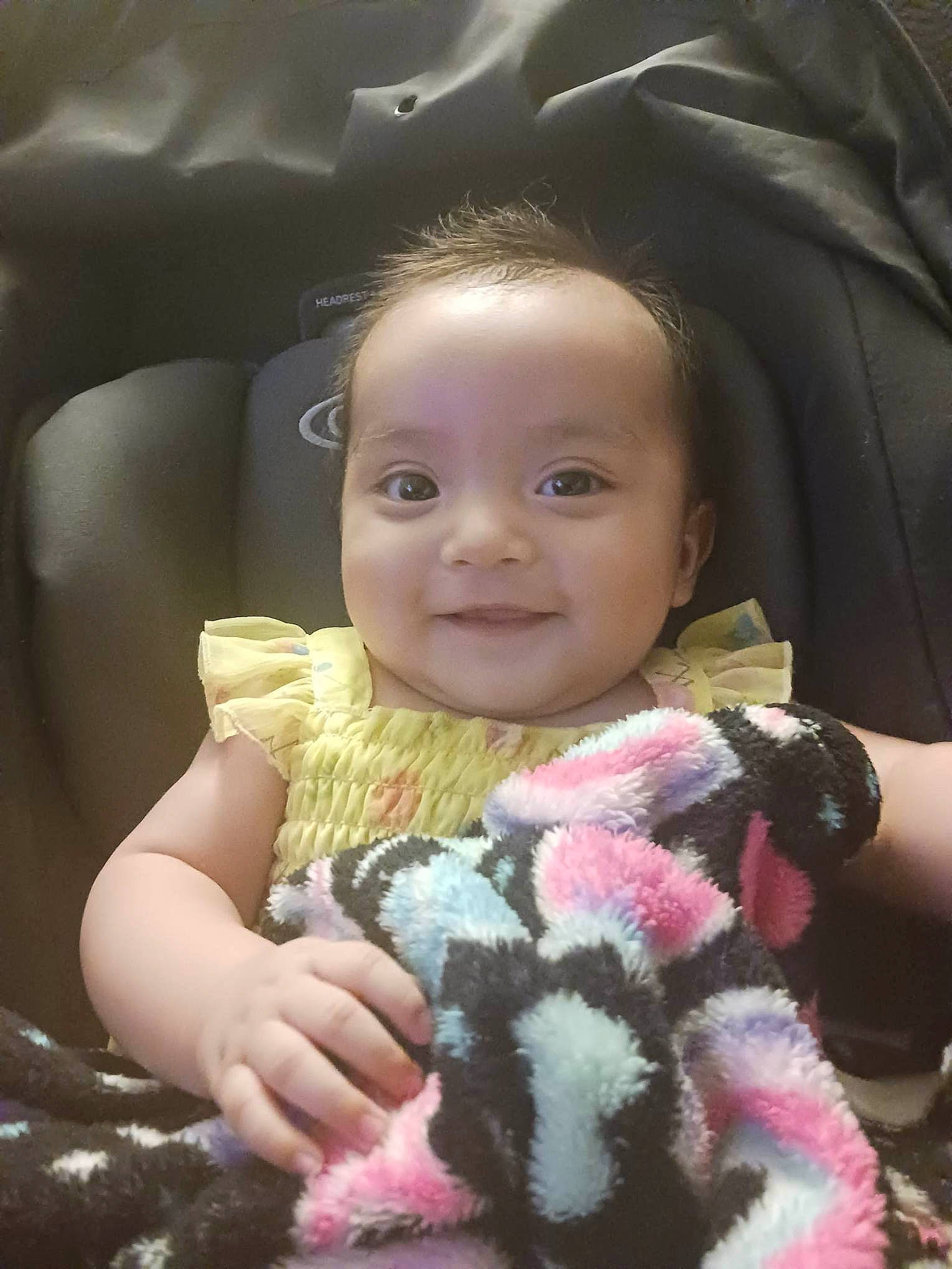 Ariah is registered to the contest to win money with this photo: baby_toddler_clothing, cheek, cool, eyelash, finger, flash_photography, gesture, hairstyle, hand, happy, human_body, iris, joy, mammal, mouth, nose, person, skin, sleeve, smile