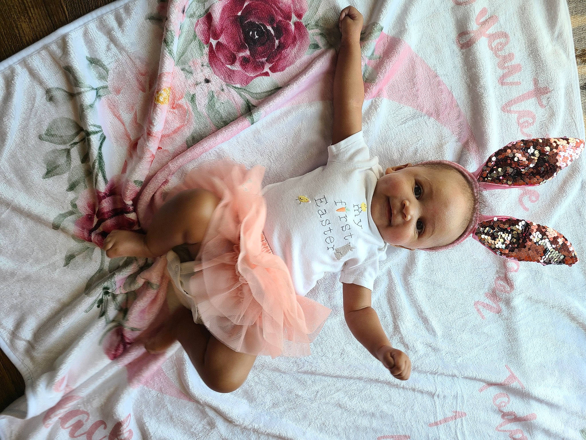 Kitana is registered to the contest to win money with this photo: baby, baby_toddler_clothing, child, comfort, dress, face, fashion_accessory, flower, hand, happy, headgear, linens, pattern, person, petal, pink, rose, skin, sleeve, textile