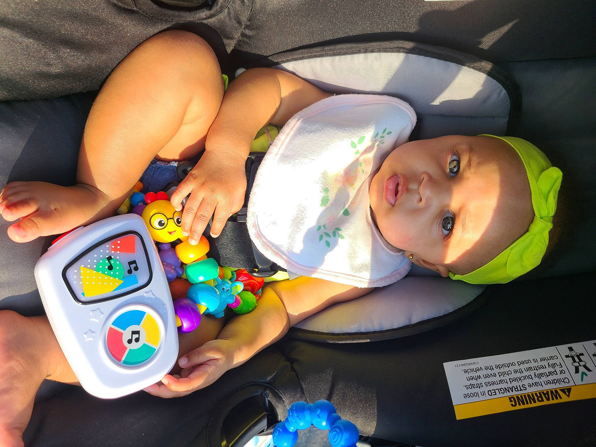 Kitana is registered to the contest to win money with this photo: baby, baby_products, baby_toddler_clothing, child, comfort, fun, gadget, happy, headwear, mouth, nail, person, plastic, play, product, room, smile, t_shirt, thumb, toddler