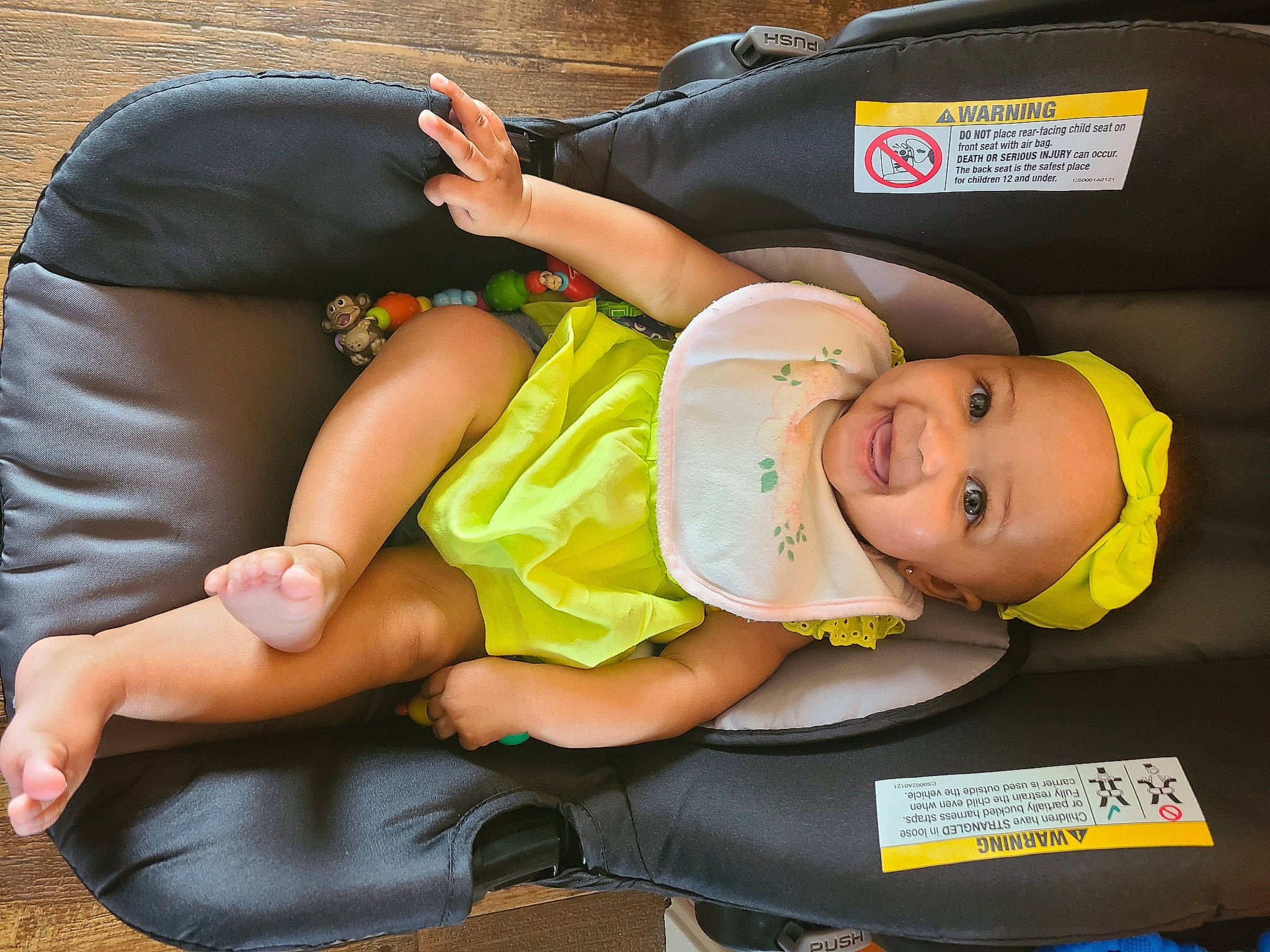 Kitana is registered to the contest to win money with this photo: baby, baby_carriage, baby_products, baby_safety, baby_toddler_clothing, car_seat, child, comfort, foot, hat, headwear, human_leg, joy, knee, lap, leg, person, shorts, sitting, sock