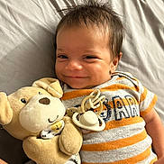 Sevenn joined the competition — help win amazing prizes! baby, infant, smile, plush_toy, stuffed_animal, bed, onesie, striped_clothing, child, cute, happy, indoors, person, face, head, lying_down, pacifier, soft_toy, toy, cozy