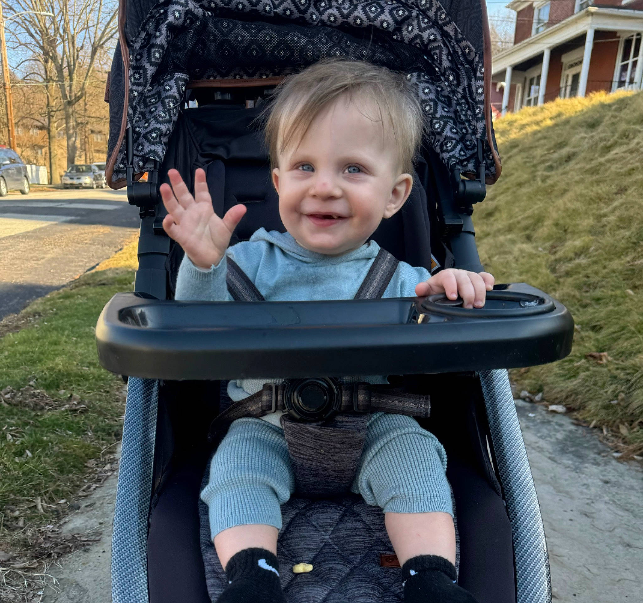 Orlando is registered to the contest to win money with this photo: baby, baby_carriage, black, chair, eye, face, fun, grass, happy, joy, lap, leaf, leisure, outdoor_furniture, person, plant, product, public_space, sitting, smile