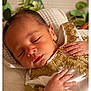 Isleym participe au concours pour gagner de l'argent avec cette photo : baby, blanket, closed_eyes, closeup, cute, decor, face, gold_embroidery, hand, indoors, infant, knitted, newborn, peaceful, plant, portrait, resting, sleeping, soft_lighting, white_clothing