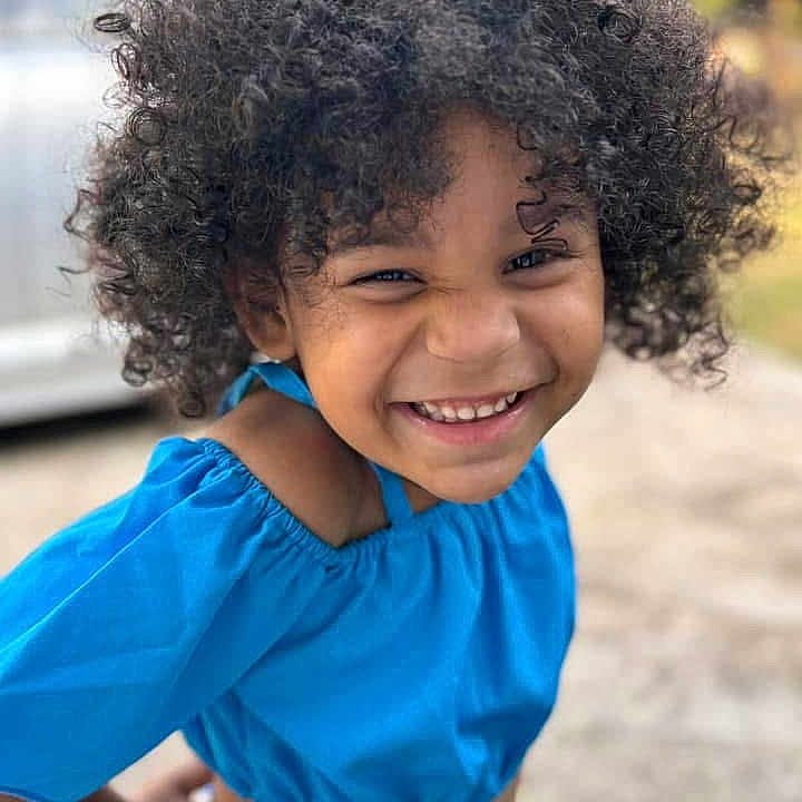 Keari joined the competition — help win amazing prizes! blue_top, child, childhood, close_up, curly_hair, cute, expression, eyes, face, fashion, fun, hand, happy, joyful, natural_light, outdoor, person, portrait, skin, smiling