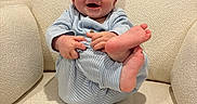 Jackson joined the competition — help win amazing prizes! baby, child, infant, smile, happy, pajamas, blue, feet, hand, face, armchair, furniture, cozy, indoor, cute, sitting, skin, head, expression, comfort