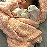 Nova joined the competition — help win amazing prizes! baby, blanket, infant, wrapped, cozy, pink, soft, sleepwear, cute, face, person, newborn, child, resting, indoors, comfort, warm, hands, expression, lying_down