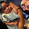 Nova joined the competition — help win amazing prizes! baby, child, denim, bow, bracelet, arm, person, seat, bag, pink, floral, clothing, cute, pout, curious, indoor, portrait, holding, infant, casual