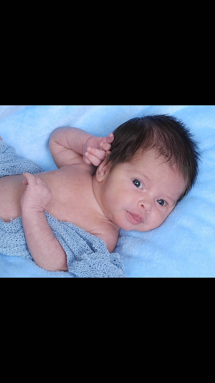 Abel is registered to the contest to win money with this photo: arm, baby, baby_toddler_clothing, cheek, elbow, eye, eyebrow, finger, flash_photography, fun, gesture, happy, iris, lip, mouth, neck, nose, person, sleeve, stomach