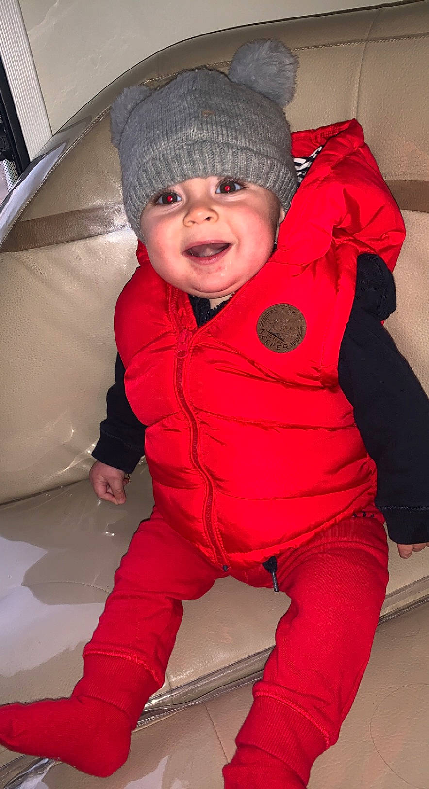 Logan participe au concours pour gagner de l'argent avec cette photo : baby, baby_toddler_clothing, cap, cheek, comfort, eye, fun, happy, head, headwear, human_body, jacket, lip, mouth, nose, outerwear, person, pink, skin, sleeve