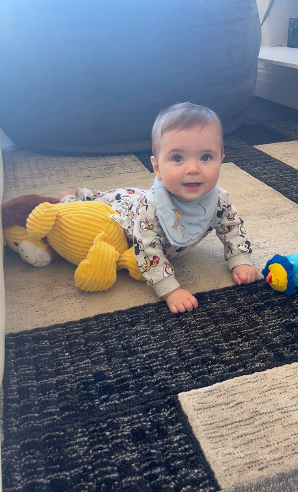 Julian is registered to the contest to win money with this photo: asphalt, baby, baby_toddler_clothing, beauty, blue, comfort, design, floor, flooring, fun, grass, happy, person, product, road_surface, sitting, smile, tints_and_shades, toddler, wood