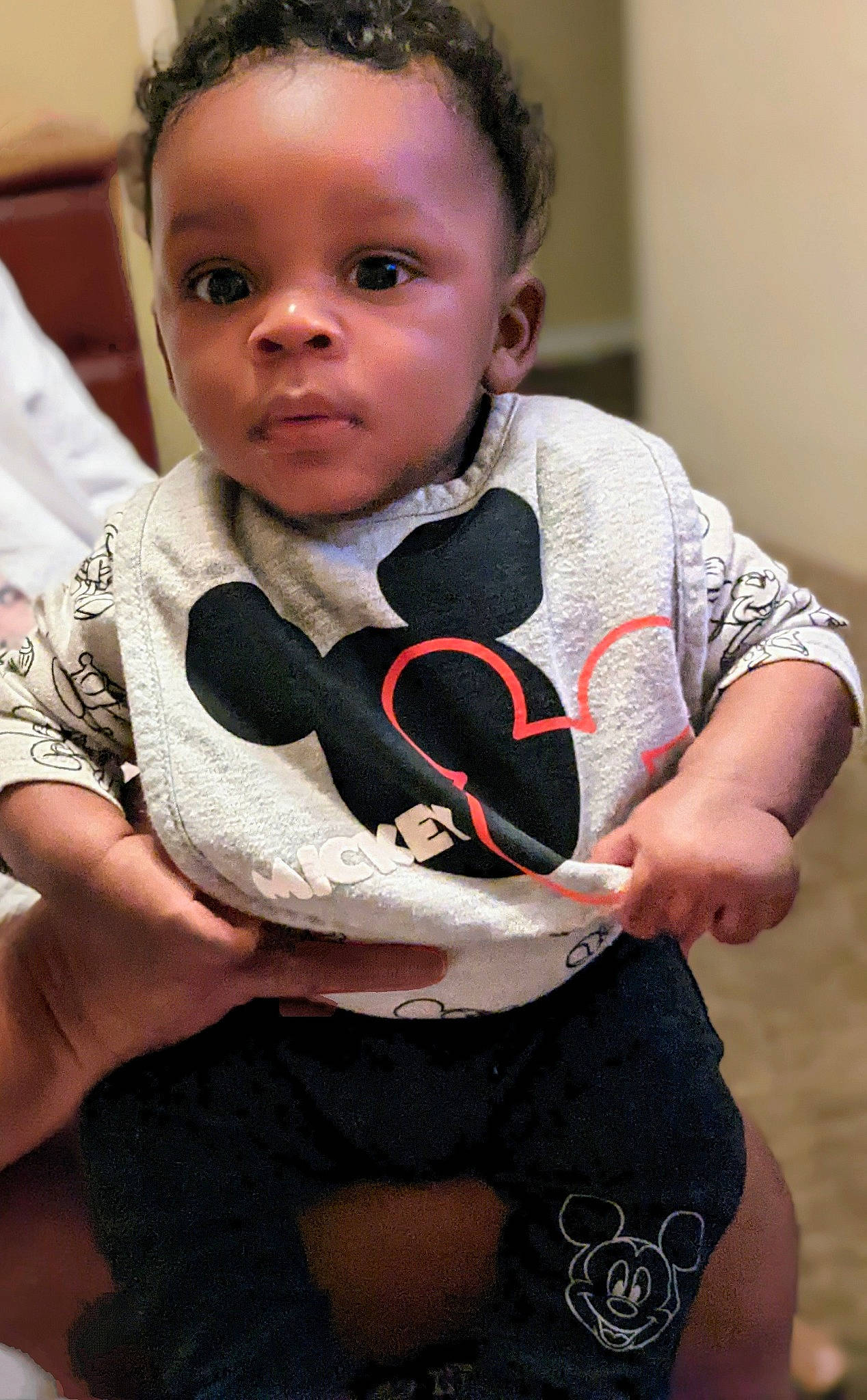 Da' Miri is registered to the contest to win money with this photo: audio_equipment, baby, baby_toddler_clothing, carmine, chair, child, comfort, eye, face, fun, happy, head, neck, pattern, person, sitting, sleeve, sportswear, t_shirt, thigh