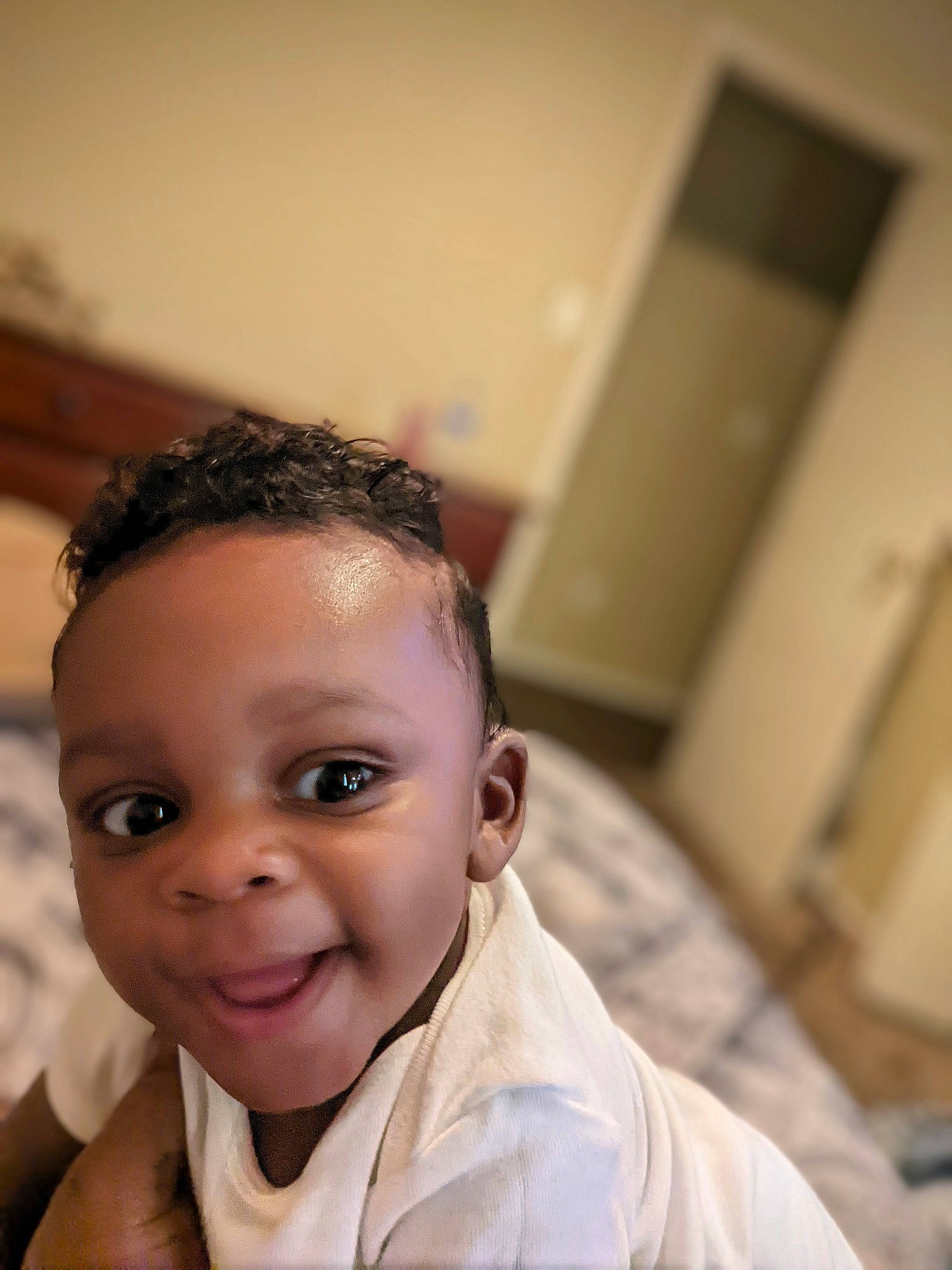 Da' Miri is registered to the contest to win money with this photo: baby, black_hair, cheek, comfort, communication_device, ear, eye, eyelash, flash_photography, forehead, fun, gesture, happy, iris, joy, nose, person, room, sitting, smile