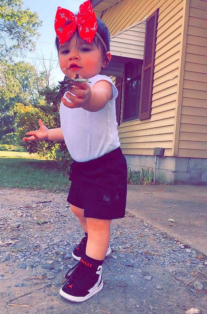 Aniyaah is registered to the contest to win money with this photo: cool, electric_blue, grass, happy, headwear, house, human_leg, knee, magenta, pattern, person, pink, plant, purple, red, sleeve, street_fashion, thigh, toddler, tree