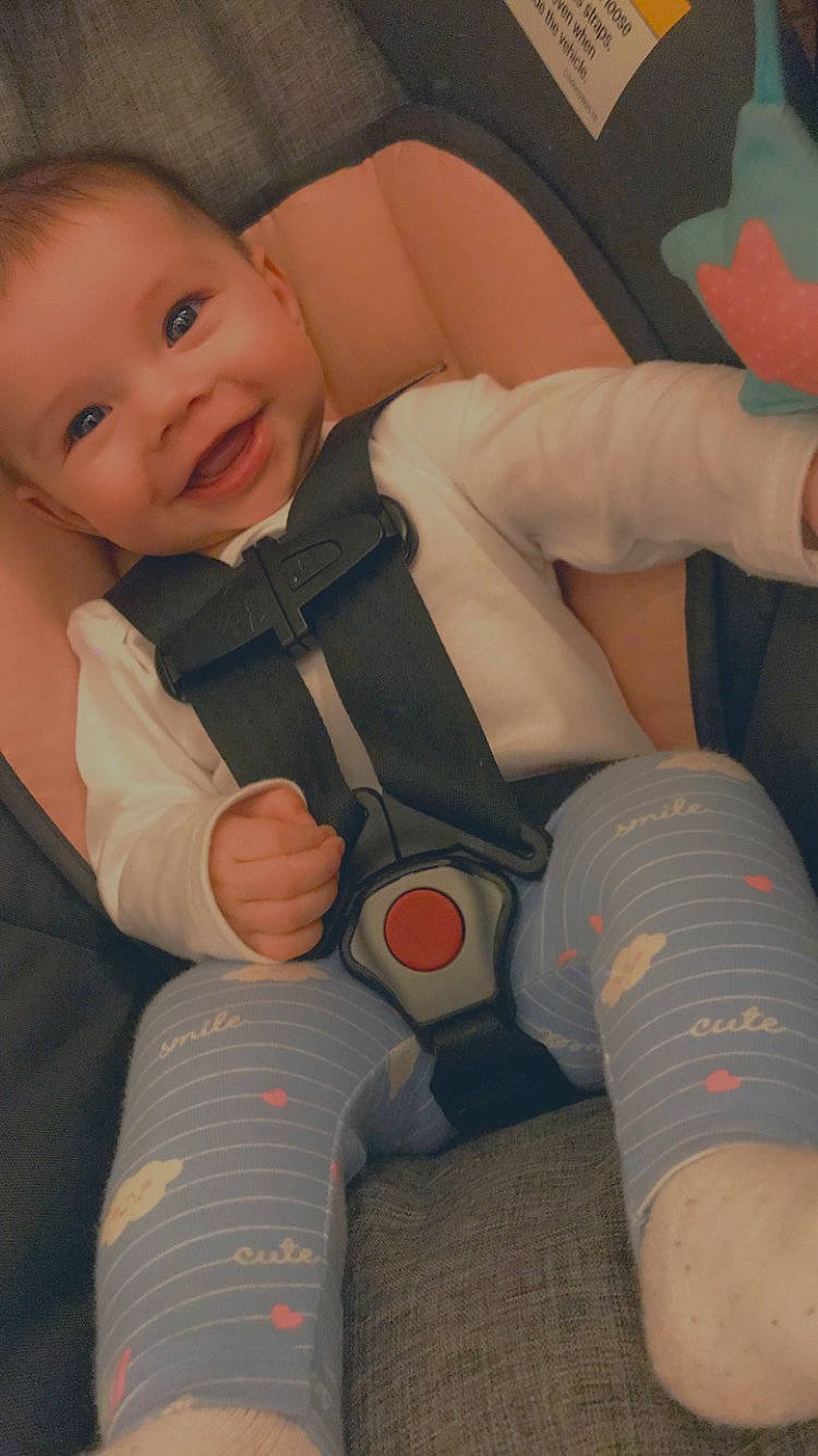 Aniyaah is registered to the contest to win money with this photo: baby_toddler_clothing, cheek, comfort, finger, fun, gesture, hand, human_body, joint, joy, knee, leg, mouth, nail, orange, person, skin, smile, textile, thigh