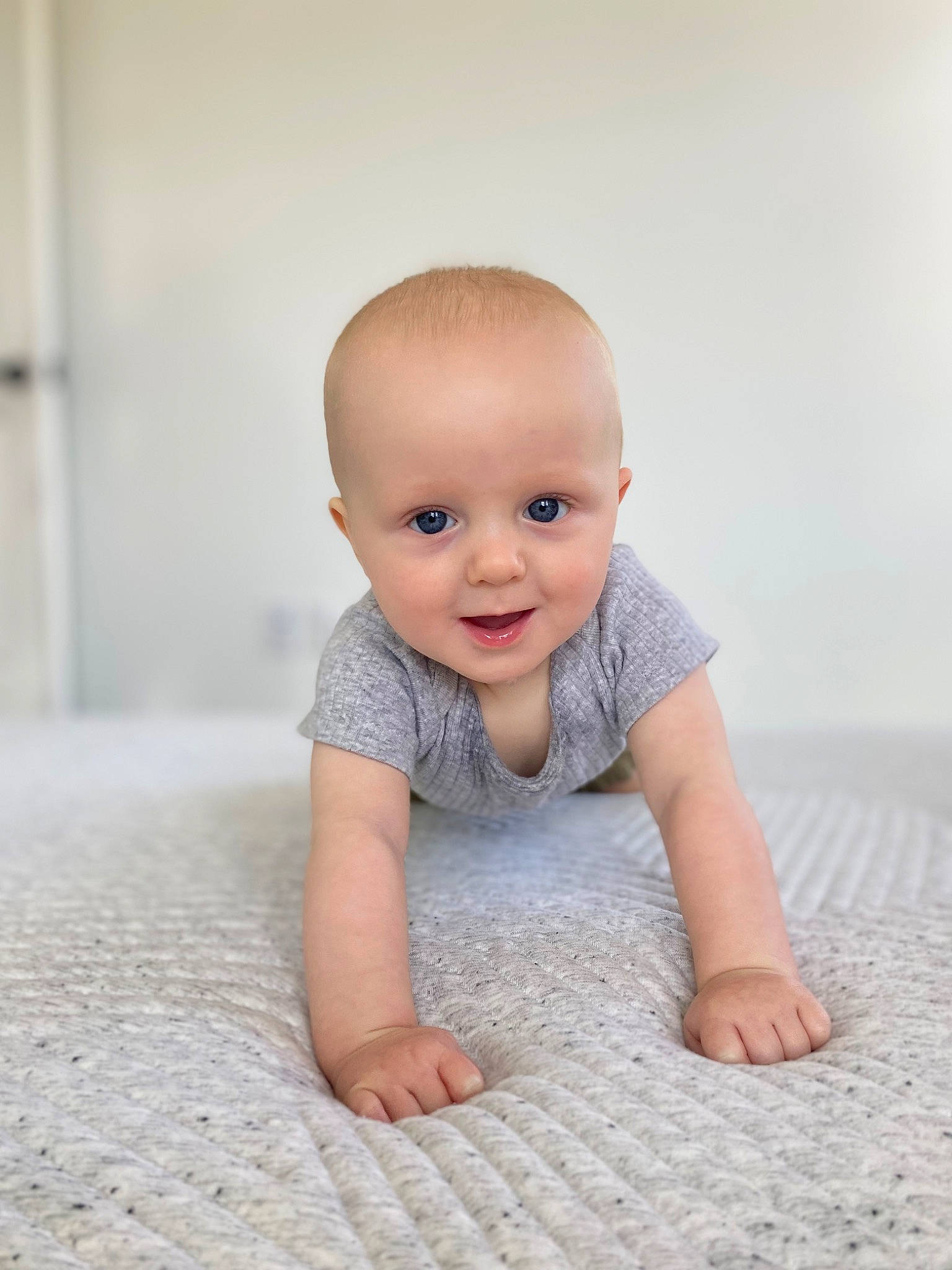 Finley joined the competition — help win amazing prizes! baby, baby_crawling, baby_toddler_clothing, cheek, child, comfort, crawling, flash_photography, floor, flooring, grey, happy, hardwood, iris, joy, nose, person, skin, sleeve, smile