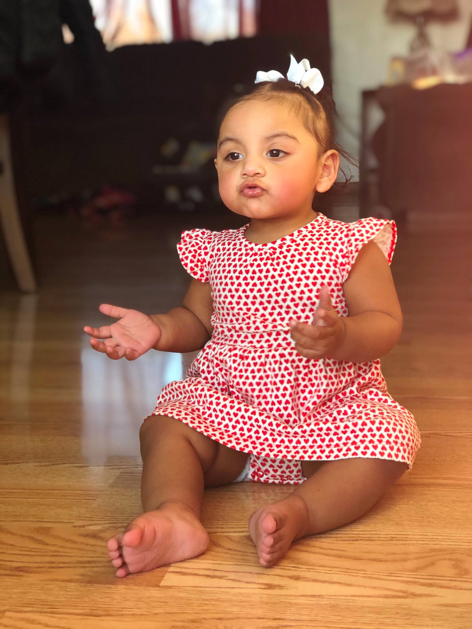 Rosalia is registered to the contest to win money with this photo: baby, baby_toddler_clothing, barefoot, cheek, child, child_model, clothing, dance, design, floor, flooring, pattern, person, pink, polka_dot, sitting, skin, sleeve, toddler