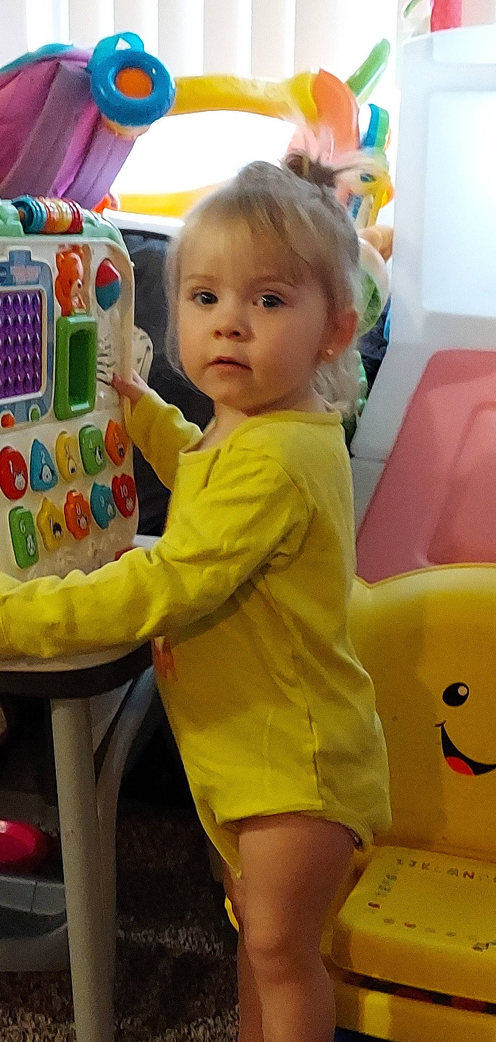 Mayella is registered to the contest to win money with this photo: baby, baby_playing_with_toys, baby_toddler_clothing, cheek, child, comfort, face, fun, green, happy, human_leg, person, photograph, play, sitting, skin, snapshot, thigh, toddler, toy