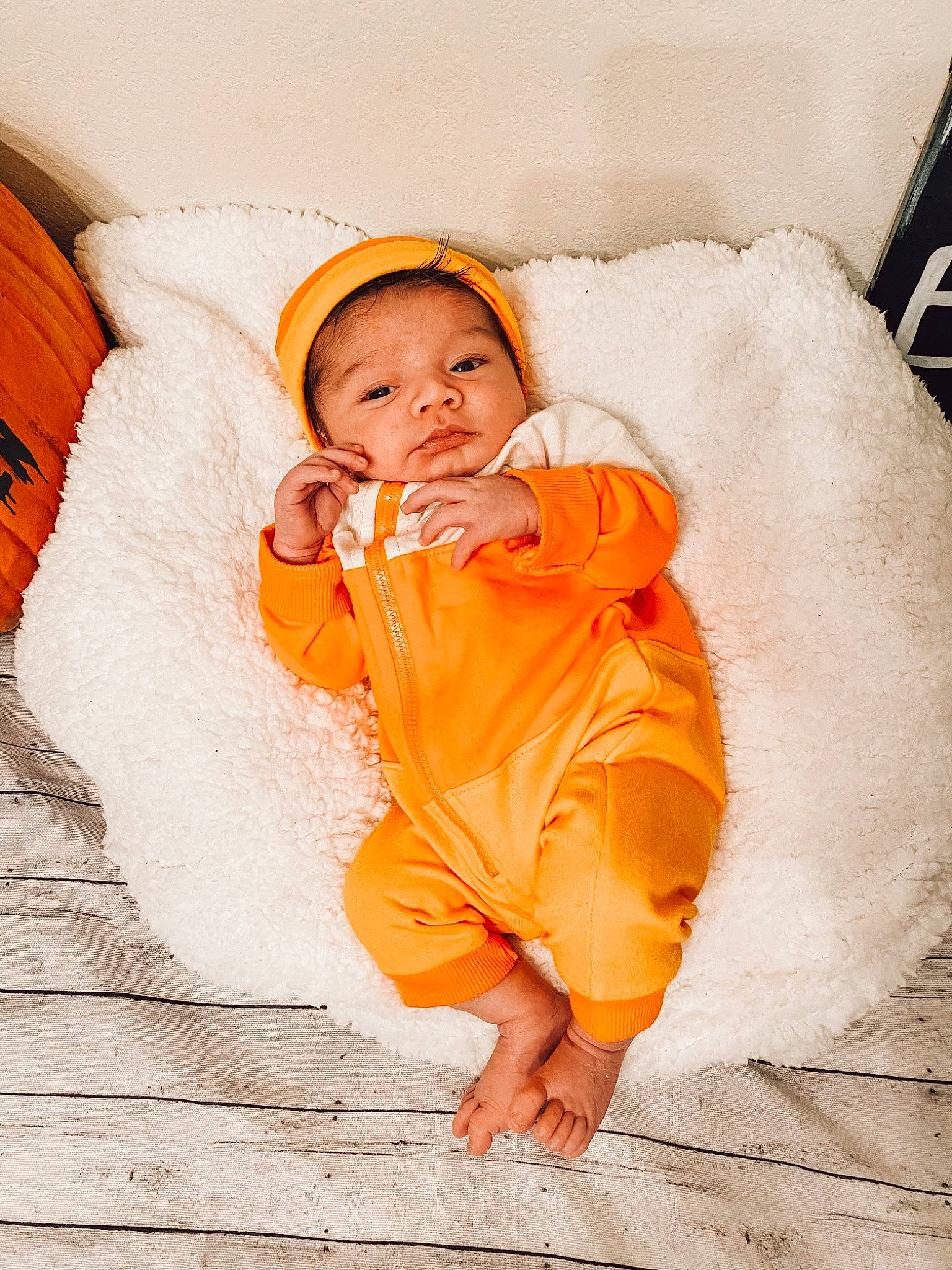 Valentine is registered to the contest to win money with this photo: baby, baby_sleeping, baby_toddler_clothing, bonnet, cheek, child, child_model, comfort, costume_accessory, hood, nose, orange, peach, person, photo_shoot, portrait_photography, toddler, winter